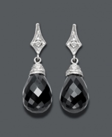 The perfect complement to your little black dress -- these divine drops will create a dramatic effect. Set in 14k white gold, a round-cut diamond (1/3 ct. t.w.) shines against the backdrop of faceted onyx (14 mm x 10 mm). Approximate drop: 1 inch. The perfect complement to your little black dress -- these divine drops will create a dramatic effect. Set in 14k white gold, a round-cut diamond (1/3 ct. t.w.) shines against the backdrop of faceted onyx (14 mm x 10 mm). Approximate drop: 1 inch.