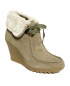Get in touch with the earthier side of style this season. The Ingle shooties by White Mountain take classic moccasin booties and feminize them with a wedge heel and trendy faux fur cuff.