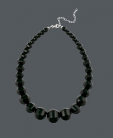 Perfect your look in standout style. Necklace by Avalonia Road features bold, black onyx beads (6-1/2-22 mm) that form a statement-making, graduated halo. Set in sterling silver. Approximate length: 16 inches. Perfect your look in standout style. Necklace by Avalonia Road features bold, black onyx beads (6-1/2-22 mm) that form a statement-making, graduated halo. Set in sterling silver. Approximate length: 16 inches.