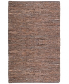 Olé! Spice up your decor with the gorgeously festive style of the Matador rug from St. Croix. Durable leather strips in warm, earthy hues are meticulously hand woven with fine cotton strands, resulting in a beautiful, rustic texture and natural braided pattern that accents even the most eclectic decor.