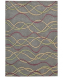 Graphic appeal: an abstract, wavy design flows across the silver field of Nourison's mesmerizing City Limits rug, giving any room a sense of urban-inspired chic. Hand-tufted of polyacrylic fibers, the rug is pleasingly soft, textured and easy to clean.