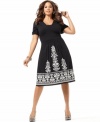 An empire design lends a flattering fit to INC's short sleeve plus size dress, accented by embellished embroidery.