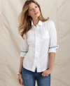 The classic white button-front shirt gets girly with ruffled trim in this Tommy Hilfiger look. Pair it with boyfriend jeans for high contrast and chic style.