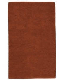Create a luxurious foundation with a rich, felted wool rug in a deep rust hue. This plush piece features an undeniably soft hand, created with the finest hand-woven New Zealand wool. Create a luxurious foundation with a rich, felted wool rug in a deep rust hue. This plush piece features an undeniably soft hand, created with the finest hand-woven New Zealand wool.