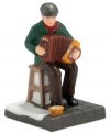 An accordion player makes everything that much merrier, playing for patrons of Murphy's Irish Pub. It's all part of the fun from the Department 56 Christmas in the City collection.