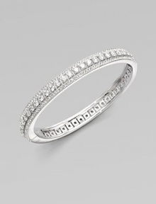 EXCLUSIVELY AT SAKS. A simple yet shimmering bangle offering two elegant rows of pavé crystal edging a center row of larger cubic zirconia stones.Cubic zirconia and crystal Rhodium plated Diameter, about 2¼ Hinged with push-lock clasp Imported