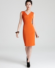 Add color to your closet with this boldly-hued Escada dress with sunburst seaming detail and a structured silhouette. Add color to your closet with this boldly-hued Escada dress with sunburst seaming detail and a structured silhouette.