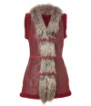 Luxurious shearling vest in red lambs leather and fur - Must-have boho piece for fall and winter - Features a slim, long design with decorative fur at collar and front, zippered pockets and buckles at front - Wear with leggings or skinny jeans and a favorite thin cashmere top underneath