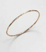 From the Smooth Rose Collection. A wavy oval bangle with a sculptural look is crafted of sterling silver and 18k gold finished with the warm glow of 18k rose goldplating.18k gold and sterling silver with 18k rose goldplatingDiameter, about 2Slip-on styleImported