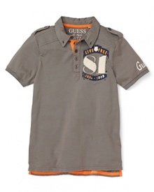 GUESS updates the traditional polo with cool military details and patchwork appliqué accents. GUESS updates the traditional polo with cool military details and patchwork appliqué accents.