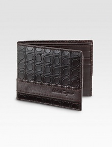 Richy crafted Italian leather, stamped with a signature gamma pattern and logo detail. Six card slots, two bill compartments 4½W X 3½H Made in Italy Richy crafted Italian leather, stamped with a signature gamma pattern and logo detail. Six card slots, two bill compartments 4½W X 3½H Made in Italy
