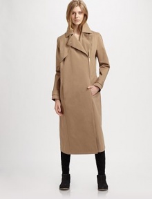 Modernized by an asymmetrical zipper, this military-inspired trenchcoat has notched lapels, slash pockets and a back vent for mobility. Notched lapelsButton frontAsymmetrical zipperLong sleeves with buttoned cuffsSlash pocketsButtoned back belt; back ventAbout 36 from shoulder to hemCottonDry cleanMade in ItalyModel shown is 5'10 (177cm) wearing US size 2.