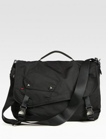 A traditional messenger with downtown edge, features a removable crossbody strap, ample pockets and additional padding for your computer devices.Flap, buckle closureTop handleAdjustable shoulder strapExterior, interior pocketsNylon18W x 11H x 5DImported A traditional messenger with downtown edge, features a removable crossbody strap, ample pockets and additional padding for your computer devices.Flap, buckle closureTop handleAdjustable shoulder strapExterior, interior pocketsNylon18W x 11H x 5DImported