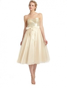 Tonal sequins shine on the bodice of this exceptionally chic tea length style with a delicate sash cinching the waist.Spaghetti straps Tonal sequined bodice Interior bra cups Tie-sash waist Back zipper Pleated organza skirt Fully lined About 47 from shoulder to hem Polyester Spot clean Imported