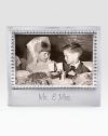 A fitting setting for wedding photos, hand-crafted of recycled aluminum with etched Mr. & Mrs. inscription along the bottom.Accommodates a 4 X 6 photoRecycled aluminum6.75W X 5.75HWipe cleanImported