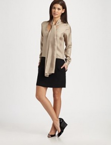 The quintessential combination of a feminine blouse and a classic skirt, a unique design with an elongated tie detail and convenient slash pockets.Self-tie detailButton cuffs on long sleevesButton closureSide zipperSlash pocketsSolid skirtBack yokeAbout 15 from natural waistSilkDry cleanMade in USA of imported fabric Model shown is 5'9½ (176cm) wearing US size Small. 