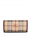 With its characteristic check and plentiful pockets, Burberry Londons continental wallet is an iconic way to keep your most valuable essentials organized - Haymarket check coated canvas, chocolate leather trim and lining, flap with snap closure, back slot pocket, multiple credit card slots inside, zippered coin purse - Carry alone for running quick errands, or stash away in a sophisticated leather tote