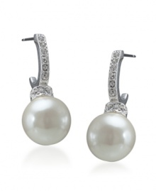 Channel sheer elegance with simple drops by Carolee. Pave crystal covered hoops feature a petite glass pearl drop. Crafted in mixed metal. Approximate drop: 1/8 inch. Channel sheer elegance with simple drops by Carolee. Pave crystal covered hoops feature a petite glass pearl drop. Crafted in mixed metal. Approximate drop: 1/8 inch.