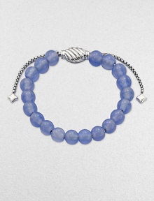 From the Spiritual Bead Collection. A simple strand of softly hued 8mm blue chalcedony beads on a sterling silver chain with an oval cable slide clasp.Blue chalcedonySterling silverDiameter, about 2Adjustable slide claspImported