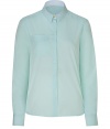 Stylish top in fine, pale green cotton - Elegant, on-trend pastel hue - Slim, classic button down silhouette, cut slightly longer in the back - Small collar, chest pocket and gently rounded hem - The detail we love: delicate, white lace trim at sides - Go for a casual look with jeans and ballet flats, or dress it up with a pleated mini and ankle booties