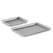 This convenient combination of two popular baking pans from Calphalon offers longstanding versatility and durability at a great value. Expertly constructed to the standards of culinary professionals, the jelly roll pan and brownie pan each feature two interlocking layers of high-performance nonstick for beautiful results and easy serving. This convenient combination of two popular baking pans from Calphalon offers longstanding versatility and durability at a great value. Expertly constructed to the standards of culinary professionals, the jelly roll pan and brownie pan each feature two interlocking layers of high-performance nonstick for beautiful results and easy serving.