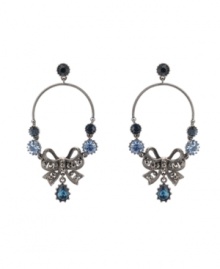 Out of the blue. Beautiful blue crystals further enhance the elegance of Betsey Johnson's stunning chandelier earrings. Featuring a delicate bow motif, they're crafted in hematite tone mixed metal. Approximate drop: 3-3/10 inches. Out of the blue. Beautiful blue crystals further enhance the elegance of Betsey Johnson's stunning chandelier earrings. Featuring a delicate bow motif, they're crafted in hematite tone mixed metal. Approximate drop: 3-3/10 inches.