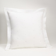 Understatedly elegant, crisp white linens are dressed up with a ribbon of silver embroidery that loops into a full bow on the duvet cover and accompanying shams. The bedskirt features a split corner pleat, accented by a ribbon of silver all around. Understatedly elegant, crisp white linens are dressed up with a ribbon of silver embroidery that loops into a full bow on the duvet cover and accompanying shams. The bedskirt features a split corner pleat, accented by a ribbon of silver all around.