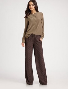 Front besom pockets, hidden button front and a hi-low hem add to the chic, oversized silhouette of this silk jewelneck blouse. JewelneckButton closureFront besom pocketsLong sleevesButtoned cuffsSilkDry cleanImportedModel shown is 5'10 (177cm) wearing US size 4. Front besom pockets, hidden button front and a hi-low hem add to the chic, oversized silhouette of this silk jewelneck blouse. JewelneckButton closureFront besom pocketsLong sleevesButtoned cuffsSilkDry cleanImportedModel shown is 5'10 (177cm) wearing US size 4.