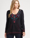 Bohemian-inspired embroidery adds a stylish touch to this cotton pull-on top.ScoopneckLong sleevesKangaroo pocketAbout 27 from shoulder to hemCottonMachine washImported