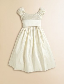 Intricate smocking gives a timeless heirloom charm to our cap-sleeved party dress, crafted from lustrous silk taffeta with a full crinoline-lined skirt and pretty sash.ScoopneckCap sleevesBack buttonsSmocked bodiceEmpire waist with tie sashRuffled and crinoline-lined petticoatSilk taffetaDry cleanImported Please note: Number of buttons may vary depending on size ordered. Intricate smocking gives a timeless heirloom charm to our cap-sleeved party dress, crafted from lustrous silk taffeta with a full crinoline-lined skirt and pretty sash.ScoopneckCap sleevesBack buttonsSmocked bodiceEmpire waist with tie sashRuffled and crinoline-lined petticoatSilk taffetaDry cleanImported Please note: Number of buttons may vary depending on size ordered.