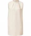 With a pristine shade of ivory silk and retro 60s silhouette, Valentinos modern tailored shift is an immaculate choice for day and evening alike - High-neckline with braided trim and pleat detail, sleeveless, pleated back - Loosely tailored fit, O-silhouette - Wear with flats and stacked up bangles, or with heels and a luxe leather jacket
