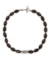 Beautifully bold with a dash of sparkle. Monet collar necklace crafted of faceted glass beads in jet black with a crystal-accented link detail at front. Set in hematite-plated mixed metal. Approximate length: 16-18 inches.