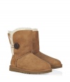 A stylish twist on a venerable classic, the Ugg Australia chestnut Bailey Button boot is a welcome addition to your cold weather casual wardrobe - Crafted from twin-faced sheepskin and featuring exposed seams, reinforced heel, traction outsole and signature Ugg label - Wooden button and elastic band closure - Fleece-lined for superior warmth and comfort - Traditional mid-calf height - Truly versatile, perfect for pairing with everything from skinny jeans to yoga pants to miniskirts