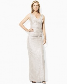 Exuding classic glamour in a floor-length column silhouette, an elegant sleeveless gown is designed in sleek metallic jersey for show-stopping appeal. Exuding classic glamour in a floor-length column silhouette, an elegant sleeveless gown is designed in sleek metallic jersey for show-stopping appeal.