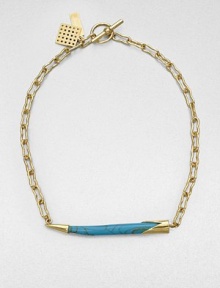 From the Horn Collection. A tapered horn-shaped pendant with the rich veining of turquoise suspends horizontally from an open golden chain for an intriguing look.Natural stone18k goldplatedChain length, about 18Pendant width, about 2.5Toggle closureMade in USA From the Horn Collection. A tapered horn-shaped pendant with the rich veining of turquoise suspends horizontally from an open golden chain for an intriguing look.Natural stone18k goldplatedChain length, about 18Pendant width, about 2.5Toggle closureMade in USA