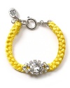 A bold take on this season's homespun trend, this fluoro woven bracelet from Juicy Couture is bright on.