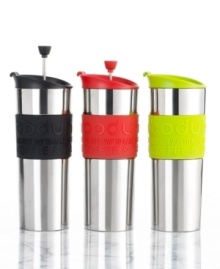 Wherever your day takes you, a fresh mug of piping hot coffee is never far behind. This thermal travel mug features a slip-proof silicone band in an array of vibrant hues, helping you enjoy your morning coffee anytime---even on the go! One-year limited warranty. Wherever your day takes you, a fresh mug of piping hot coffee is never far behind. This thermal travel mug features a slip-proof silicone band in an array of vibrant hues, helping you enjoy your morning coffee anytime---even on the go! One-year limited warranty.