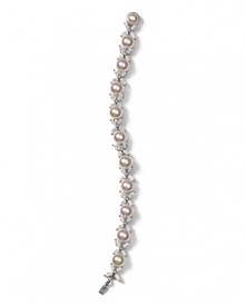 Organic manmade pearls are paired with sparkling cubic zirconia embellished butterflies in this elegant bracelet from Majorica.