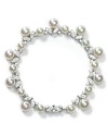 Pearls dangle from a glittering, ruffled bracelet by Majorica creating an ultra-feminine accent.