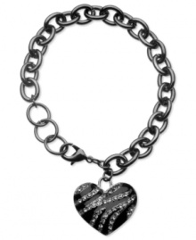 GUESS shows that its heart is in the right place with this bracelet. Crafted from hematite tone mixed metal, the bracelet features glistening glass stones for a stylish touch, bringing luster to the dark tones. Approximate length: 7-1/2 inches. Approximate drop: 1 inch.