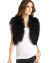 THE LOOKAllover curly lamb fur constructionOpen frontTHE FITAbout 15 from shoulder to hemTHE MATERIALMongolian curly lamb furFully linedCARE & ORIGINDry cleanFur origin: ChinaImportedModel shown is 5'10 (177cm) wearing US size Small. 