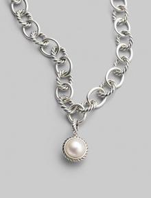 A lustrous white cultured pearl in a graceful cable frame makes an elegant addition to your own necklace or bracelet. White cultured pearl Sterling silver Diameter, about ½ Spring clip clasp Imported Please note: Necklace sold separately.