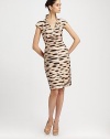 Abstract animal printed pencil dress is most flattering with seam detail and notched collar neckline.Stand mock-neck collarV necklineCap sleevesConcealed back zipSilk liningAbout 24 from natural waistCottonDry cleanImported of Italian fabricModel shown is 5'11 (180cm) wearing US size 4. 