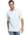 Casual wear meets high technology. This polo shirt from Tommy Bahama wicks moisture for the ultimate in cool comfort.