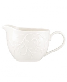 With an elegant white-on-white pattern featuring an embossed vine motif and radiant glaze, the Opal Innocence Carved gravy boat gets your table set for refined dining every day. Qualifies for Rebate