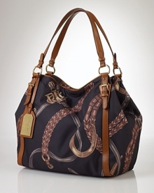 Lauren by Ralph Lauren makes it easy to embrace an equestrian-inspired ethos with this tote. In a classic scarf motif with leather trims, this bag lends itself to a well-bred look. Lauren by Ralph Lauren makes it easy to embrace an equestrian-inspired ethos with this tote. In a classic scarf motif with leather trims, this bag lends itself to a well-bred look.