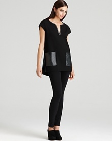 Master minimalist style with a boxy DKNY dress, flaunting faux leather pockets for modern edge.