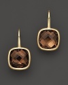 Bold, faceted smoky quartz gems glitter in 14K yellow gold settings.