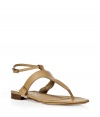 Achieve effortless warm weather style in these flat sandals from Salvatore Ferragamo - T-strap style, ankle strap with buckle closure, flat with a small leather heel - Style with a relaxed tunic-style mini-dress, and a straw hat