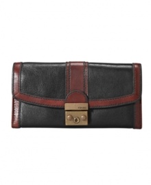 Contrast stitching and brasstone hardware lend Fossil's clutch wallet vintage-inspired charm. Contrast stitching and brasstone hardware lend Fossil's clutch wallet vintage-inspired charm.